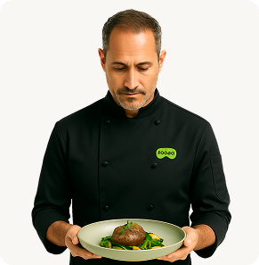 Chef holding a plated dish